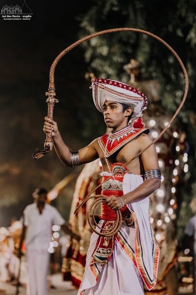 Whip crackers clearing the path for the procession